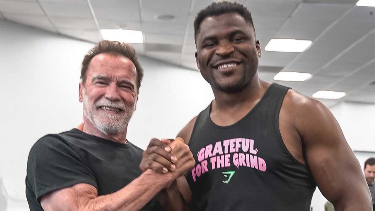 Francis Ngannou caught up with action hero and bodybuilding legend Arnold Schwarzenegger and used one of his most iconic one-liners