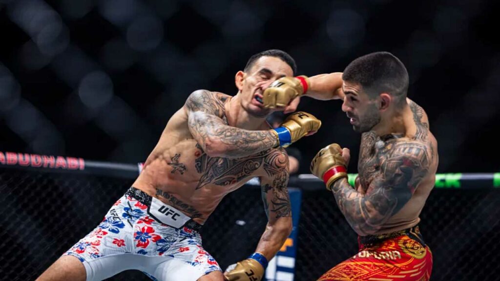 The MMA community is shocked after a crushing Ilia Topuria KO’s Max Holloway at UFC 308